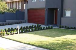Great modern front yard using aggregate concrete