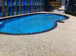 Pool area with aggregate concrete surround